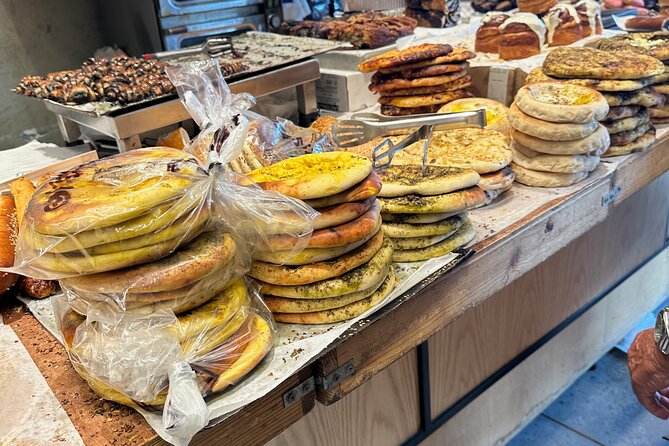 Tel Aviv: Carmel Market Food Tasting Tour “Shuk Hacarmel” - Spices, olives, bread, and sweets along the market lanes